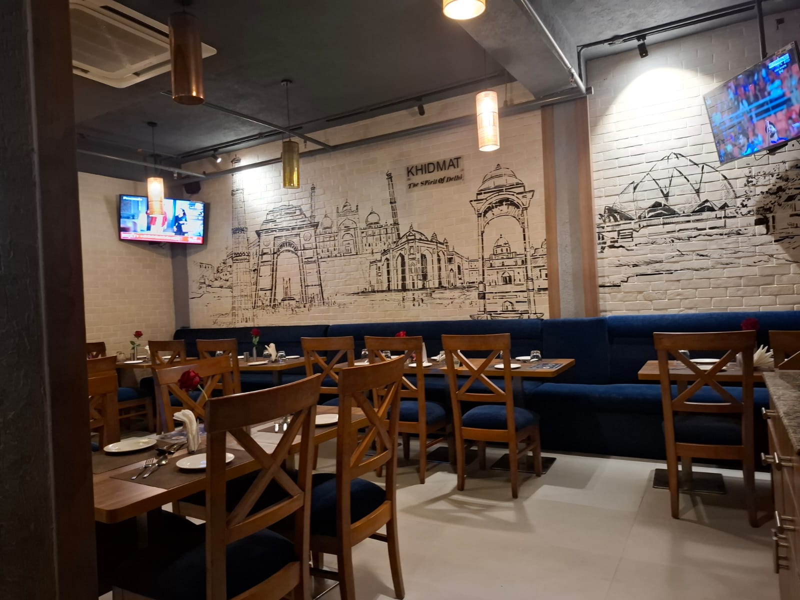 Khidmat Noida dining area with Delhi heritage mural