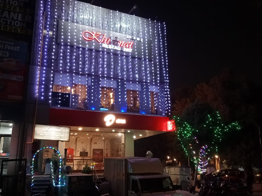 Khidmat Noida restaurant exterior at night
